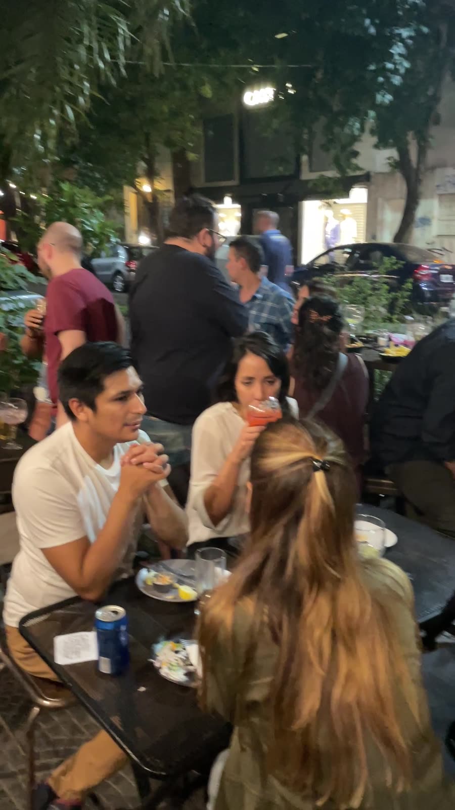 Guests around tables at a past night in Buenos Aires